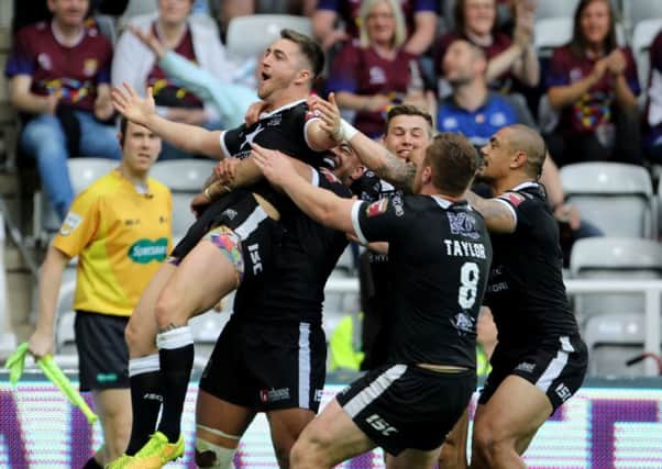 Hull FC's Curtis Naughton celebrates with his team-mates after scoring against city rivals Hull KR at St James's Park. Picture: Richard Sellers/PA