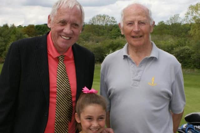 BBC Look North's Harry Gration with eight-year old junior member Lucia Maturi and senior member Peter Reynard at Lindrick GC.