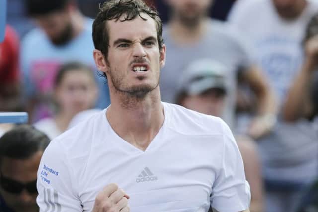 Andy Murray, of the United Kingdom, reacts after defeating Jo-Wilfried Tsonga
