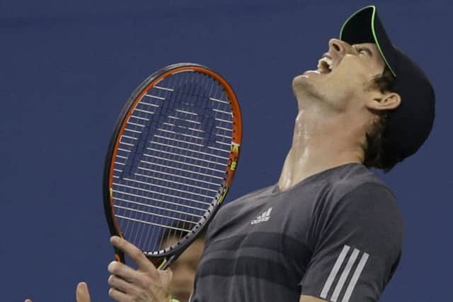 Andy Murray, of Britain, reacts after missing a shot to Novak Djokovic at the US Open in 2014. Picture: AP.