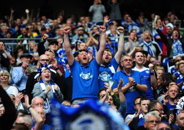 Halifax fans celebrate at Wembley. 
Picture: Jonathan Gawthorpe