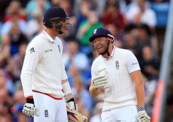 England's Jonny Bairstow shares a joke with Steven Finn during day two against Sri Lanka at Headingley. Picture: Mike Egerton/PA.
