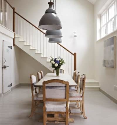This dining hall is painted in Farrow and Ball's Wimbourne White and Slipper Satin