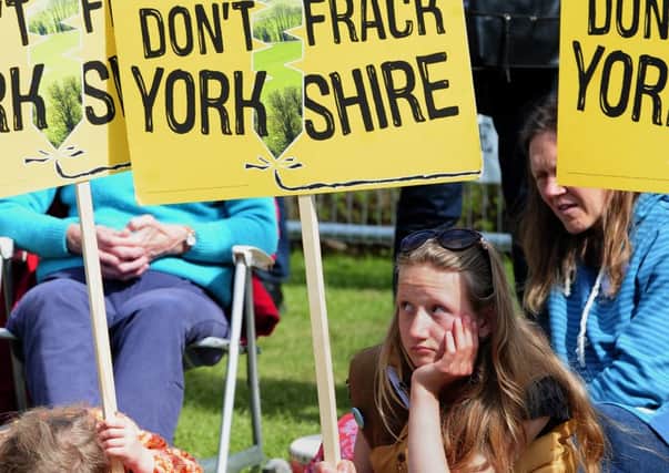 Young protestors wait outside County Hall, Northallerton, as the council meets to decide if fracking at sites in North Yorkshire should be allowed. John Giles/PA Wire