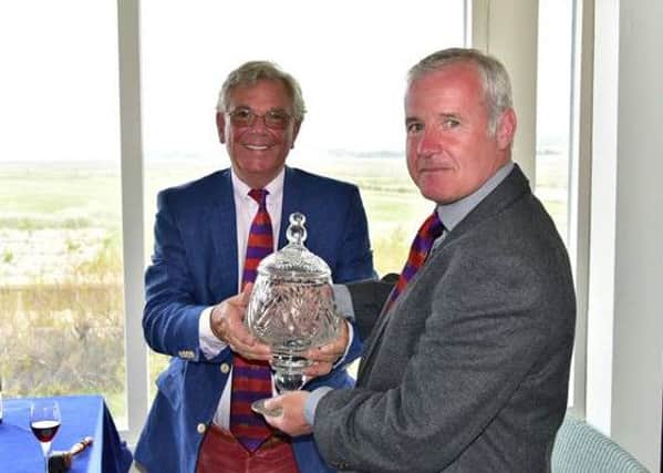 Headingley Golf Clubs secretary Jon Hall receives The Golf Club Secretarys Open Championship  trophy.