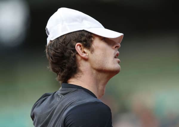 Britain's Andy Murray adjusts his cap during his French Open first-round match against Radek Stepanek of the Czech Republic (Picture: Alastair Grant).