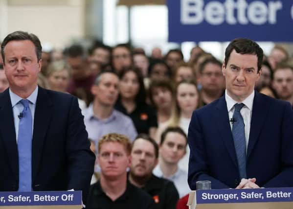 Chancellor George Osborne (right) listens as Prime Minister David Cameron delivers a speech on the economic impact of the UK leaving the European Union at B&Q headquarters.