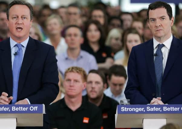 Chancellor George Osborne (right) listens as Prime Minister David Cameron delivers a speech on the economic impact of the UK leaving the European Union at B&Q headquarters.