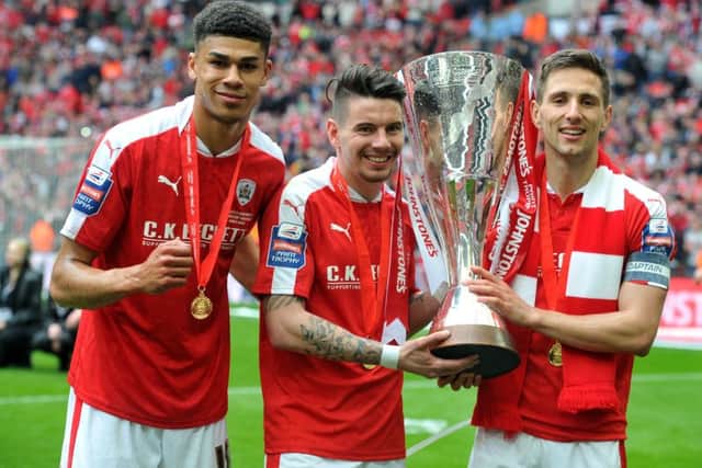 Ashley Fletcher, Adam Hammill and Conor Hourihane with the trophy. (Picture: Tony Johnson)