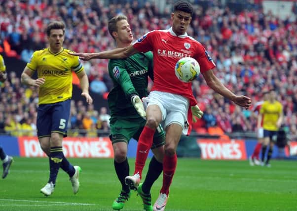 Ashley Fletcher beats the Oxford goalkeeper during the JP Trophy last month.