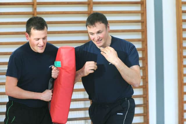 021214 North Yorkshire Police  Superintendent Adam Thomson (right)  training with a colleague  in the gym at Newby Wiske (GL1004/22j).