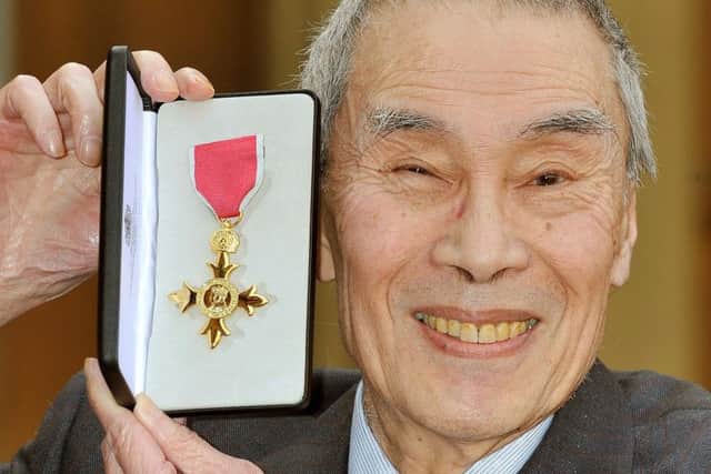 Burt Kwouk after he was presented with an OBE