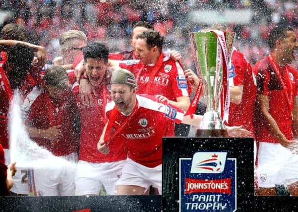 Champagne moment: Barnsley celebrate their JP Trophy success at Wembley before quickly turning their attentions to securing a play-off place. (Picture: Adam Davy/PA)