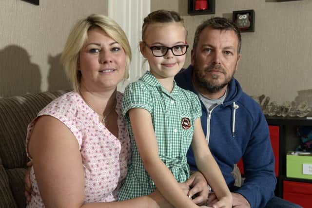 Mark and Vicky Walter, who lost their son Henry, three, to a rare strain of meningitis in January with eight-year-old daughter  Tilly.  Picture: Bruce Rollinson