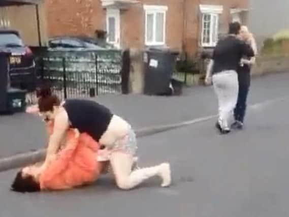 The Facebook video shows two women fighting in the street