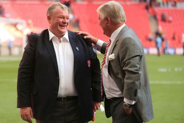 Rotherham United manager Steve Evans (left) celebrates with chairman Tony Stewart after the Sky Bet League One Play Off Final at Wembley Stadium, London.