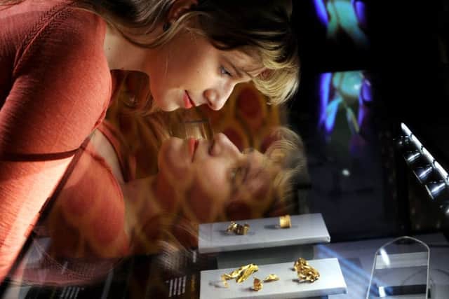 Kirsty Rogers from the Royal Armouries, and gold items from the Staffordshire Hoard Collection. Picture by Simon Hulme