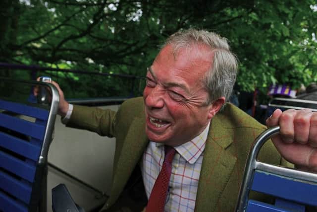 Nigel Farage ducks to avoid low-hanging branches as his open-top bus makes its way through Sheffield. Picture: Scott Merrylees