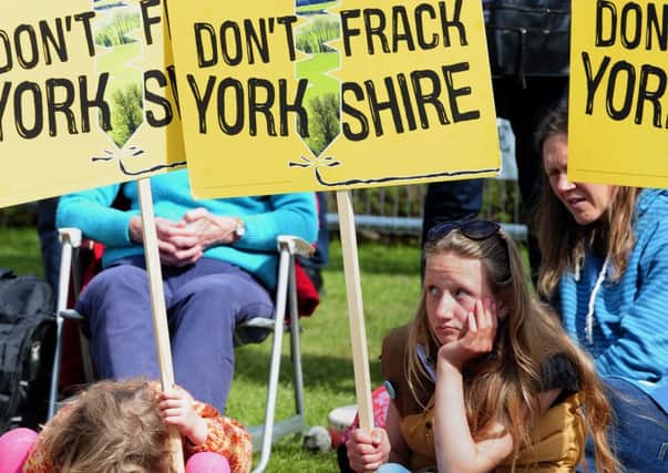 Demonstrators react with dismay after North Yorkshire councillors backed a controversial fracking application.