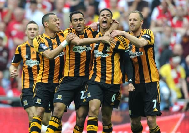 Hull City's Curtis Davies, (6) celebrates scoring against Arsenal in the FA Cup final of 2014.
