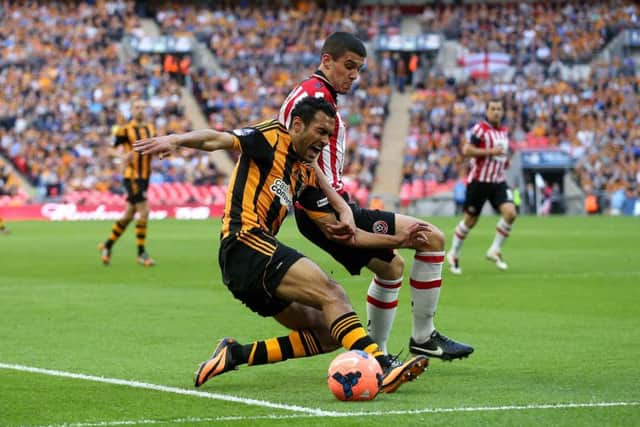 Hull City's Ahmed Elohamady and Sheffield United's Conor Coady compete during the FA Cup Semi Final in 2014. Picture: Stephen Pond/PA.