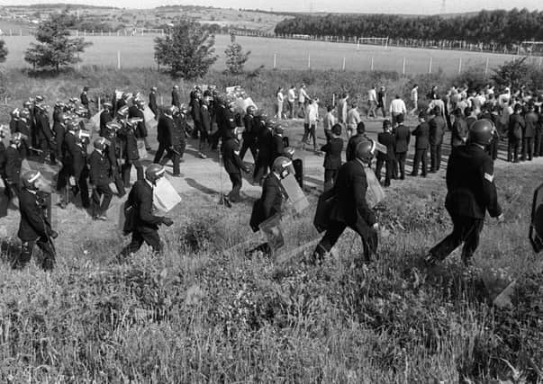 Miners and police officers at Orgreave during the Miners' Strike as calls for a new inquiry intensify.