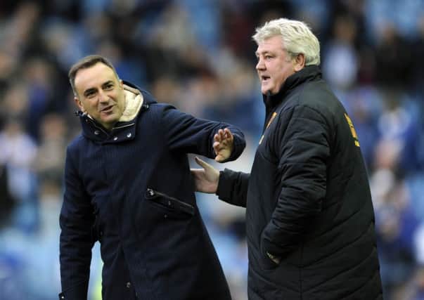 WE'LL MEET AGAIN: Rival managers Carlos Carvalhal, left, and Hull City's Steve Bruce at Hillsborough earlier in the season. Picture: Steve Ellis.