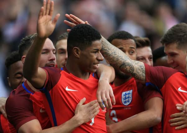 Manchester Uniteds Marcus Rashford is congratulated after scoring inside three minutes of his senior England debut against Australia (Picture:Tim Goode/PA).