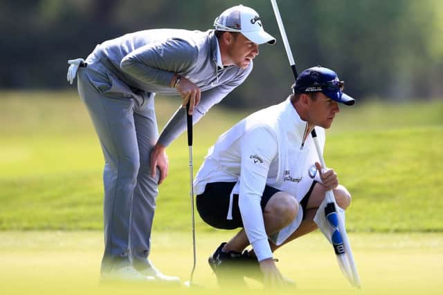 Danny Willett, (left), during day two of the BMW PGA Championship at Wentworth. Picture: John Walton/PA.