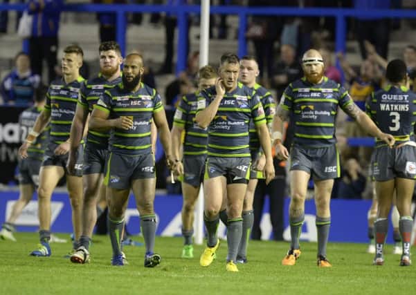 NIGHT TO FORGET: Leeds Rhinos' dejected players leave the field after losing 52-18 to Warrington Wolves last month. Picture: Bruce Rollinson