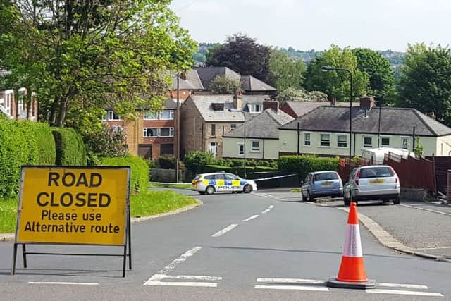 Police at the scene in Wadsley Lane, near the junction with Braemoor Road, South Yorkshire, as a teenager has been arrested following the death of an 18-year-old man.