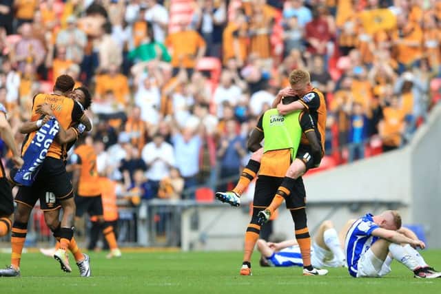 Hull City players celebrate victory at the final whistle.