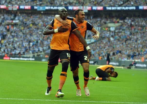 MAGIC MAN: Hull's Mo Diame celebrates his  goal with Ahmed Elmohamady.  Picture: Tony Johnson