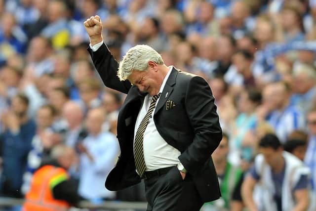 Steve Bruce, top, raises his fist at the final whistle as Hull City clinch promotion back to the Premier League at the first attempt. Bruces future in charge, however, remains in doubt.