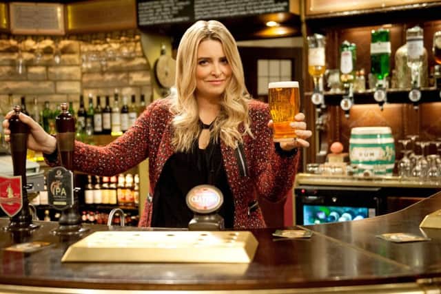 Emmerdale's Charity Dingle, played by Emma Atkins, the current landlady of The Woolpack