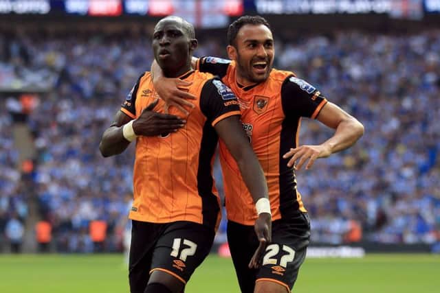 Hull City's Mohamed Diame celebrates scoring his side's first goal of the game with Ahmed Elmohamady (right)