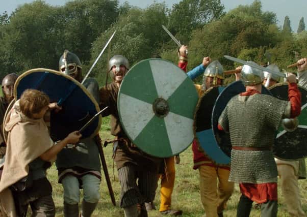 Saxons take on Vikings  at the  re-enactment of the Battle of Fulford in 1066 at Fulford, York  in 2006. Schoolchildren will take part in re-enactments in September to mark the 950th anniversary.
