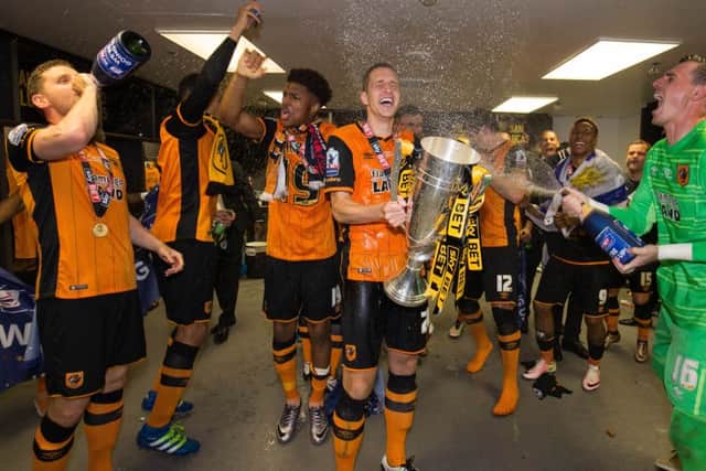 Hull City players inside the dressing room after winning the Championship Play-Off Final against Sheffield Wednesday at Wembley