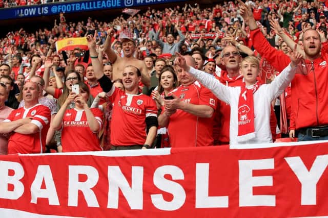 Barnsley fans celebrate in the stands