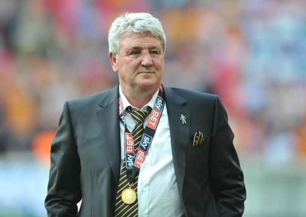 Steve Bruce raises a slight smile after guiding his Hull team to the Premier League, but will he still be around to manage them? (Picture: Tony Johnson)