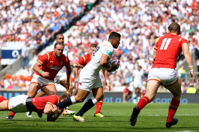 England's Luther Burrell (centre) breaks free to score their first try  at Twickenham on Sunday. Picture: Gareth Fuller/PA.