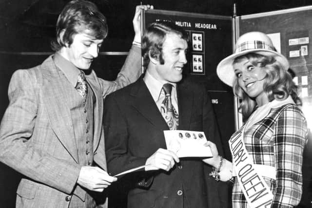 Leeds, Wellington Street, 9th November 1972

Allan Clarke (left) and Mick Jones, the Leeds United stars, with Gaynor Lacey, 22 year old Jersey Holiday Queen, at the Holiday Exhibition at the Yorkshire Post Building.