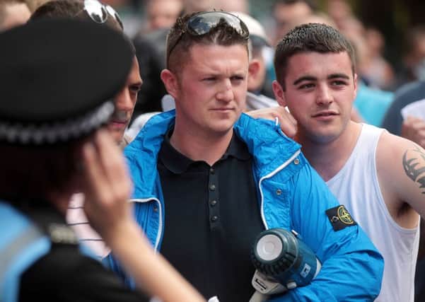 Tommy Robinson at an EDL rally in Sheffield in 2013. He is now one of the leaders of the Pegida group