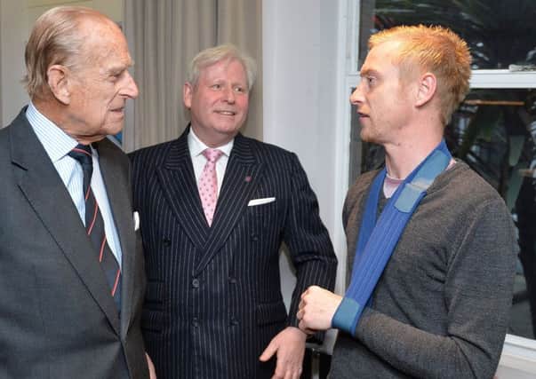 The Duke of Edinburgh (left) talks to Philip Brooks who served in the Royal Engineers, during a visit to the Veterans Aid hostel in London . He later met Nathan Rooke, from Sheffield.