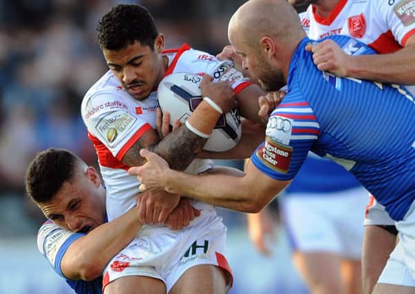 Hull Kingston Rovers winger Kieran Dixon is stopped in his tracks by two Wakefield Trinity Wildcats defenders during Thursdays Super League encounter at Belle Vue, where the visitors late call-up scored a hat-trick of tries. (Picture: Dave Williams)