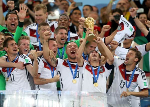 Germany's Philipp Lahm celebrates winning the World Cup with team-mates after the FIFA World Cup Final at the Estadio do Maracana, Rio de Janerio, Brazil. (Picture: Mike Egerton/PA Wire).