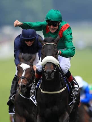 Harzand ridden by jockey Pat Smullen wins the Investec Derby.