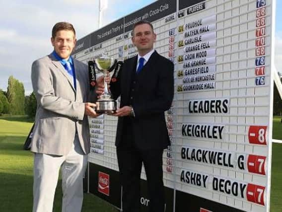 Keighley's professional Andrew Rhodes, right, and Luke Roberts after their victory at Fulford.