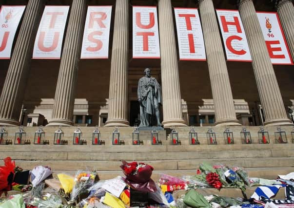A giant banner at St George's Hall in Liverpool, with a candle lit for each of the 96 Liverpool fans who died as a result of the Hillsborough disaster. it was erected after an inquest concluded the Liverpool fans had been unlawfully killed.