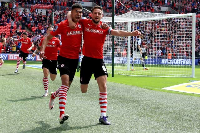 Barnsley's Ashley Fletcher (left), pictured celebrating with team-mate Barnsley's Conor Hourihane at Wembley, is understood to be a target for Leeds United.